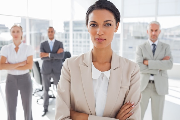 Attractive serious businesswoman with arms crossed 