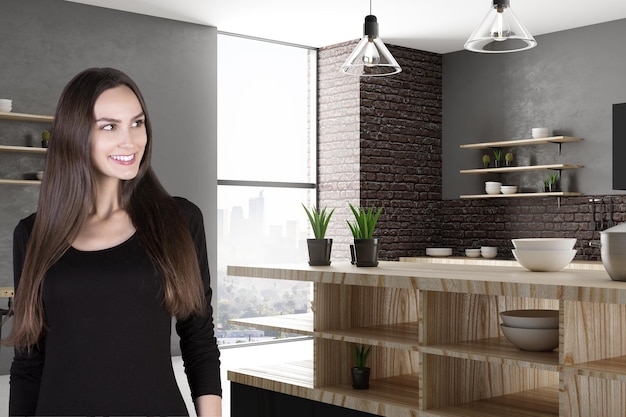 Attractive smiling woman in kitchen