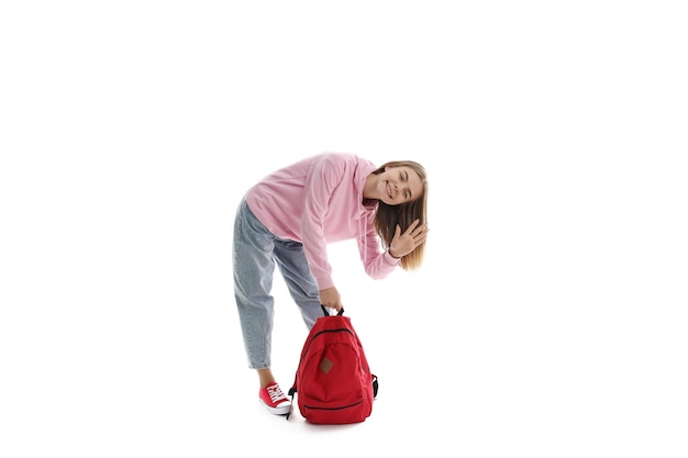 Attractive student girl isolated on white background