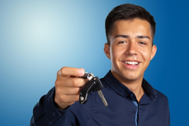 Attractive teenage boy holding car keys