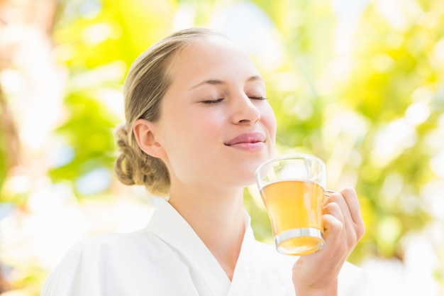 Attractive woman drinking tea