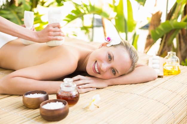 Attractive woman getting massage on her back