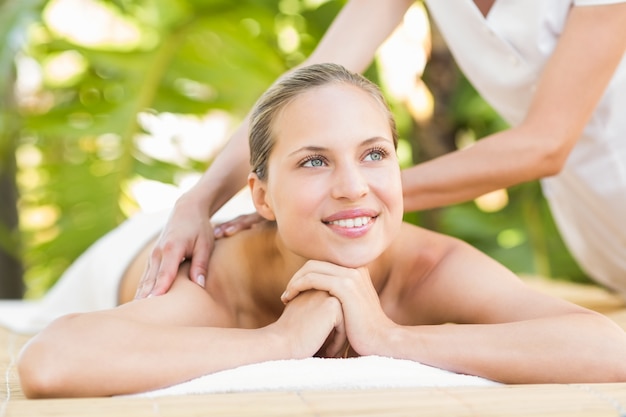 Attractive woman getting massage on her back