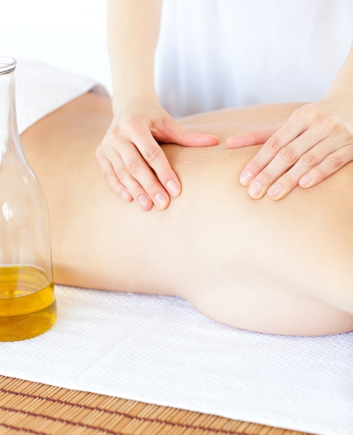 Attractive woman having a massage with massage oil