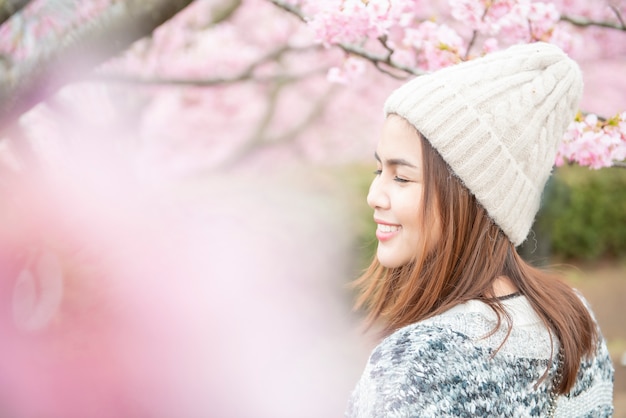 Attractive woman is enjoying  with  cherry blossom in matsuda , japan