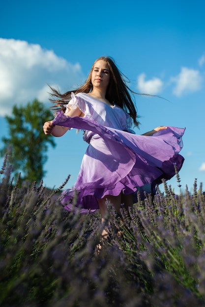 Attractive woman on the lavender field have fun
