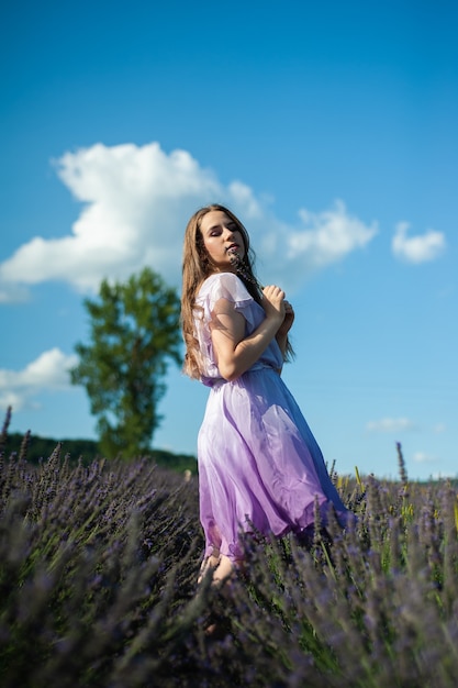 Attractive woman on the lavender field have fun