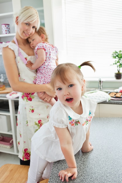 Attractive woman playing with her daughters