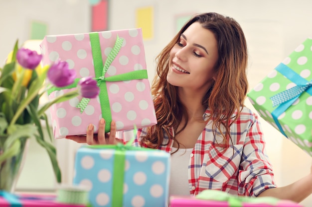 attractive woman preparing Easter presents at home