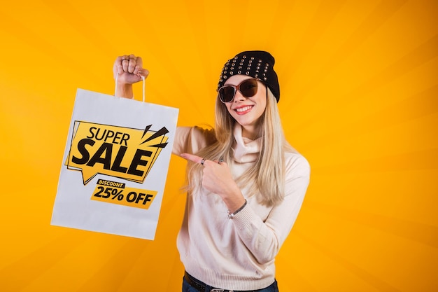 Attractive woman promoting super sale with market bags  Mockup psd