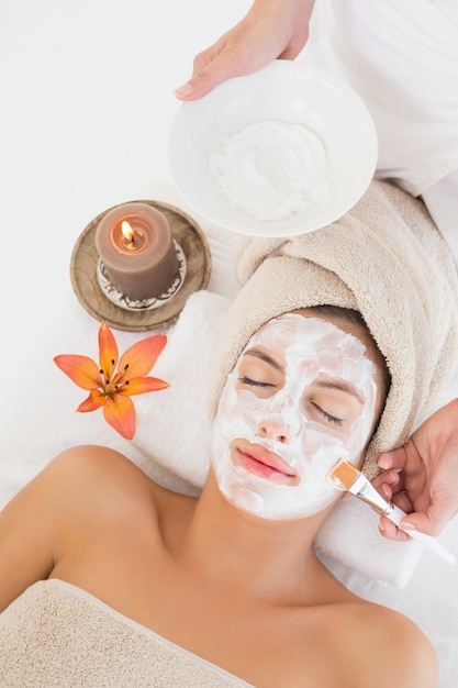 attractive woman receiving treatment at spa center