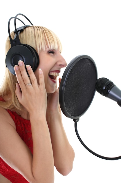 Attractive woman singing over white