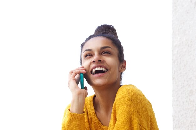 Attractive woman talking on mobile phone and laughing