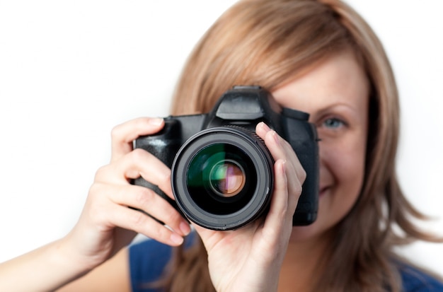 Attractive woman using a camera 