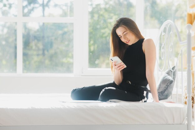 attractive woman using laptop and smiling at morning