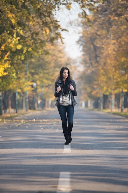 Attractive Woman Walking In Autumn Forest