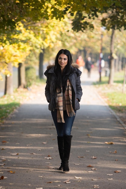 Attractive Woman Walking In Autumn Forest