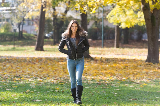 Attractive Woman Walking In Autumn Forest