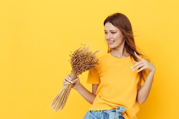 Attractive woman wearing a hat dry flowers summer style isolated background