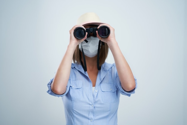 Photo attractive woman wearing protective mask isolated over white background