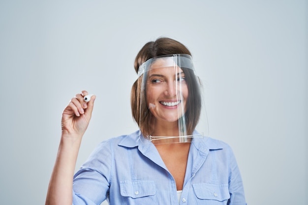 attractive woman wearing protective mask isolated over white background