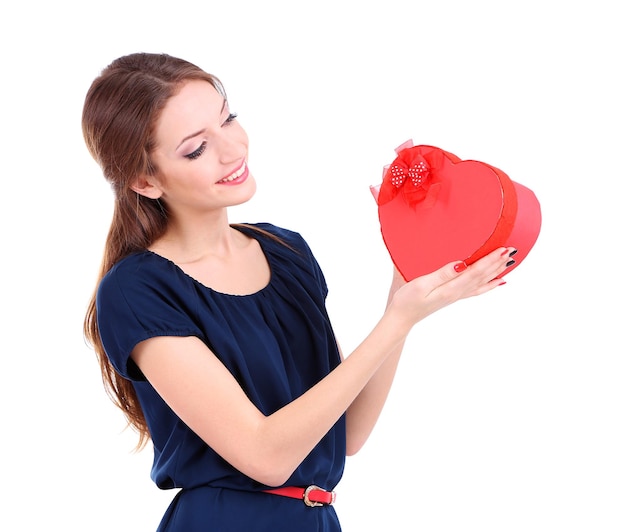 Attractive woman with box in form of  heart, isolated on white