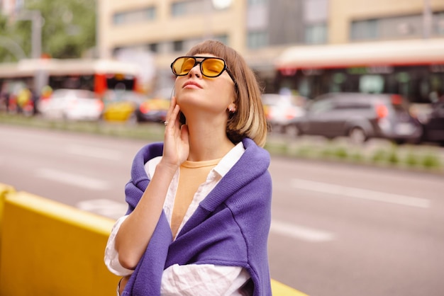 Attractive woman with close eyes in the city