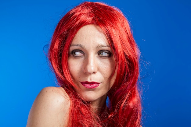 Attractive woman with huge red mane, blue chroma