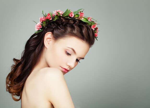 Attractive Woman with Long Healthy Hair on Grey Background Spa Portrait