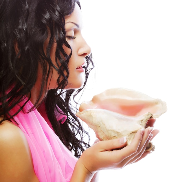 Attractive woman with marine shell