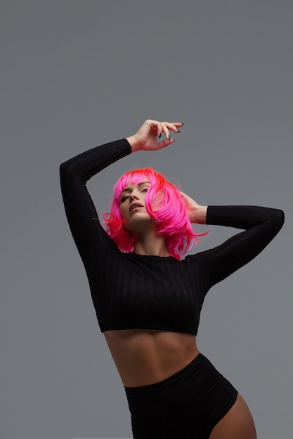 Attractive woman with pink neon hair