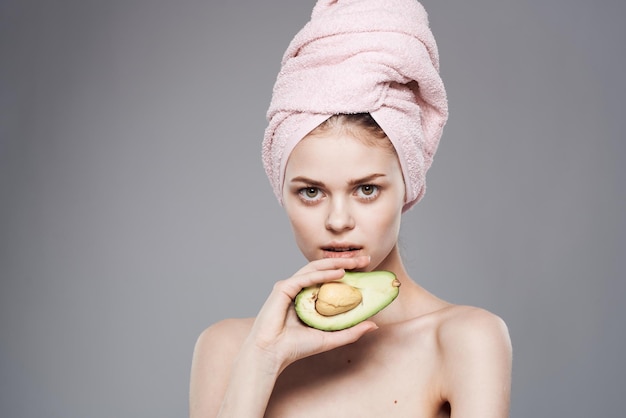 Attractive woman with pink towel on head exotic freshness cropped view