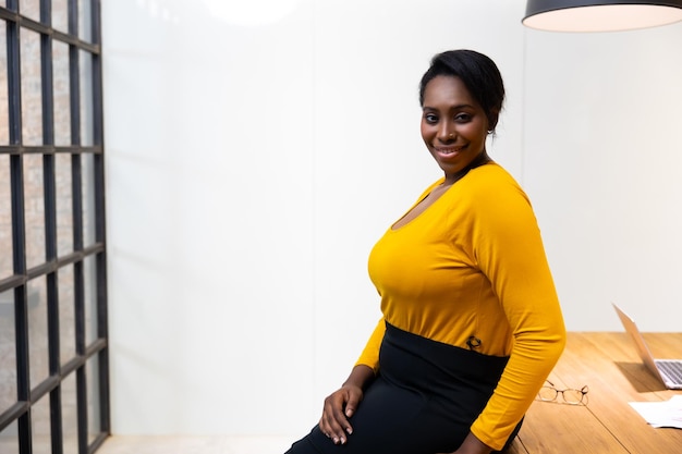 Attractive young african american confident businesswoman working in office