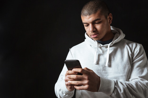 Attractive young african sportsman chatting