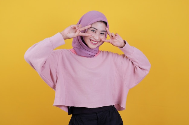 Attractive young asian woman with toothy tender smile, shows white teeth