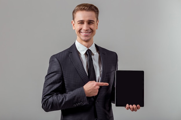 Attractive young blond businessman in classical suit.