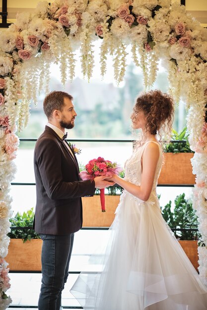 Attractive young bride and groom posing