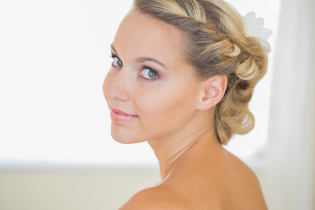 Attractive young bride looking over shoulder