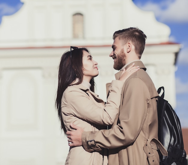 Attractive young couple hugs in the city