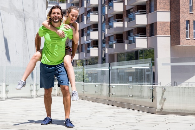 Attractive young couple train in the urban environment