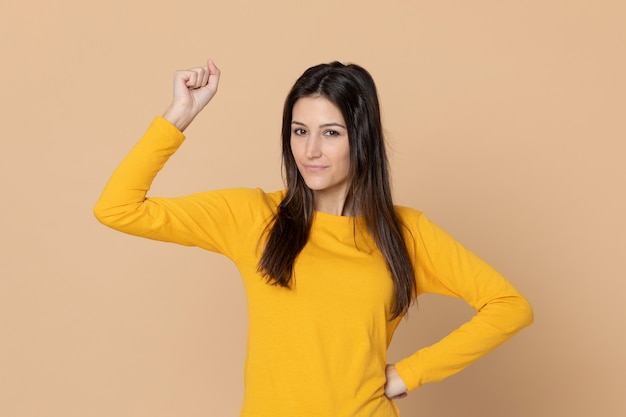 Attractive young girl wearing a yellow T-shirt