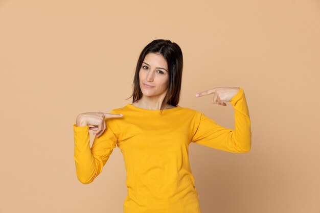 Attractive young girl wearing a yellow T-shirt