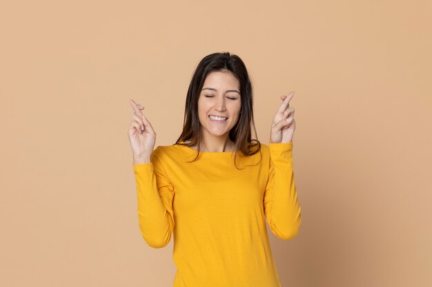 Attractive young girl wearing a yellow T-shirt