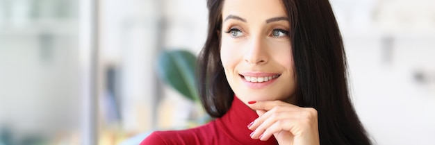 Attractive young lady with brunette haircut posing with pensive look