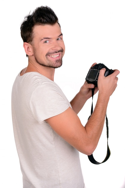 Attractive young man photographer at work in his studio