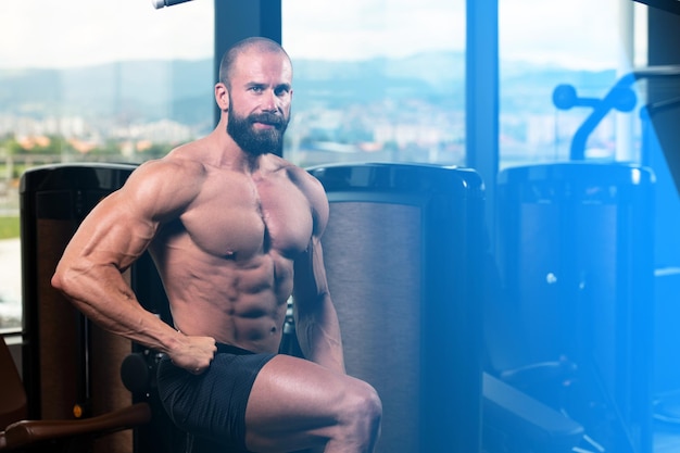 Attractive Young Man Resting In Gym Afther Exercise