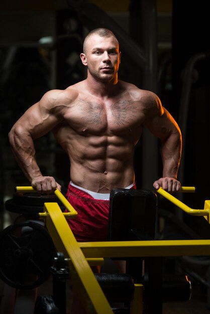 Attractive Young Man Resting In Gym Afther Exercise