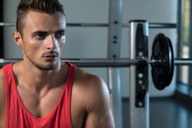 Attractive Young Man Sitting On Bench