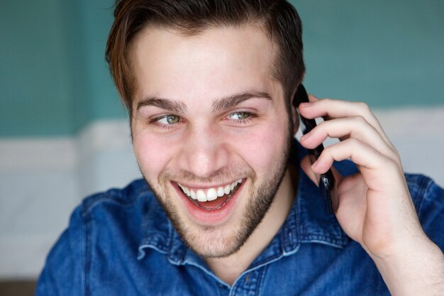 Attractive young man talking on phone