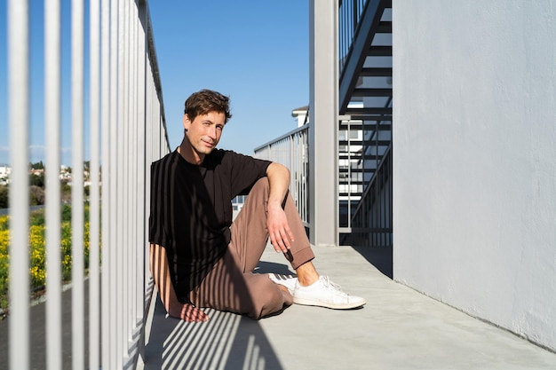 Attractive young man wearing sportswear on the street